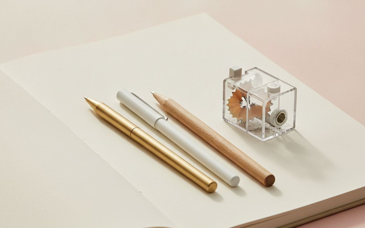 Refillable pens and a pencil sharpener with a reservoir